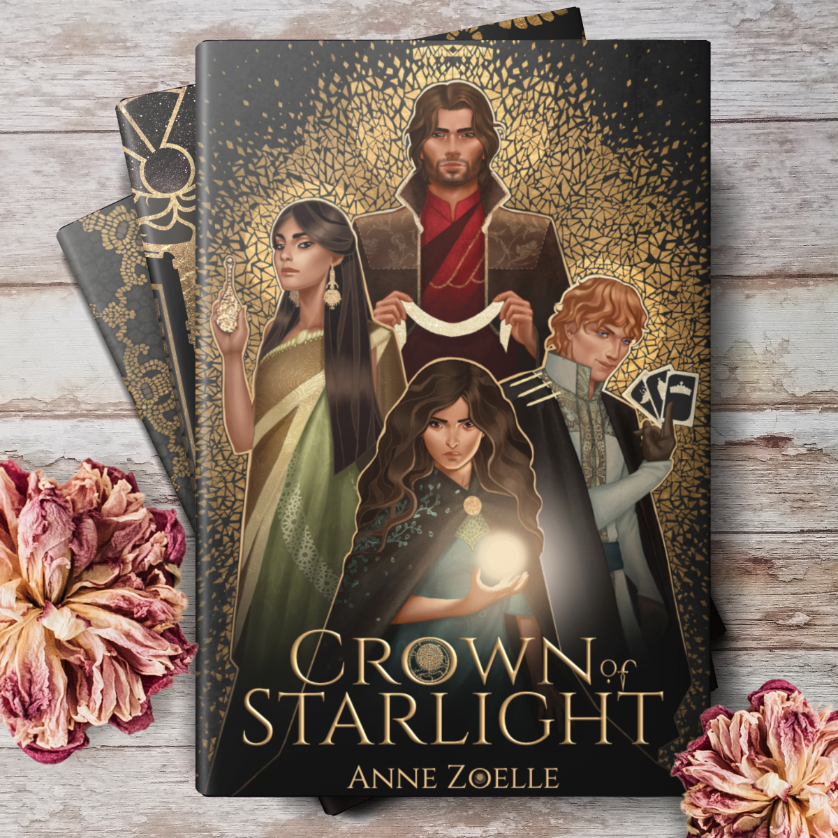Crown of Starlight book cover on a stack of books